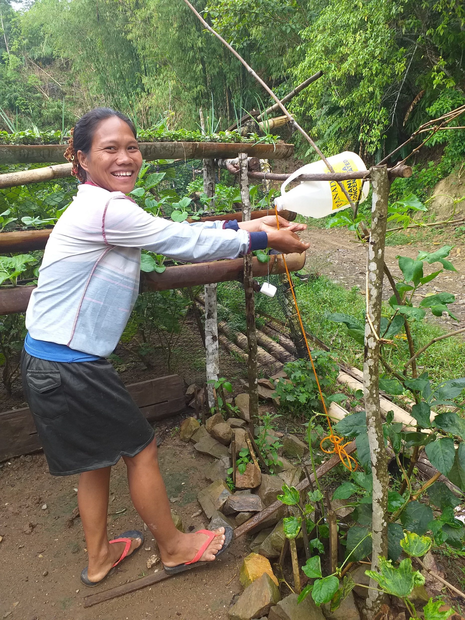Janeth shows the tippy tap she built herself