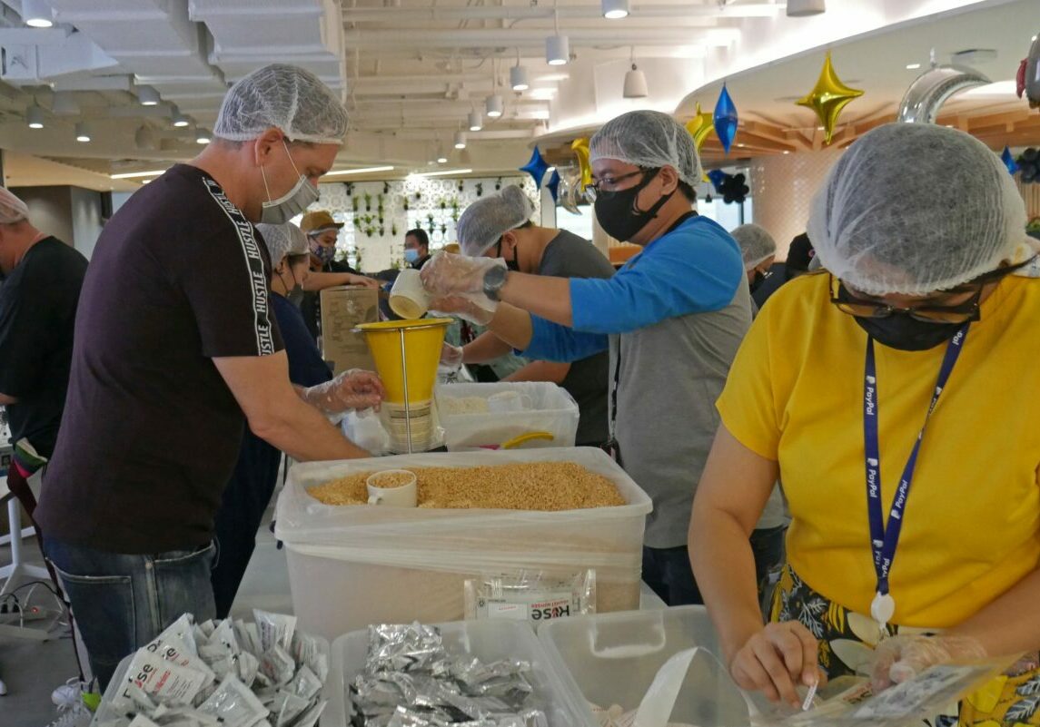 John-Nicholls-packing-meals-scaled-1
