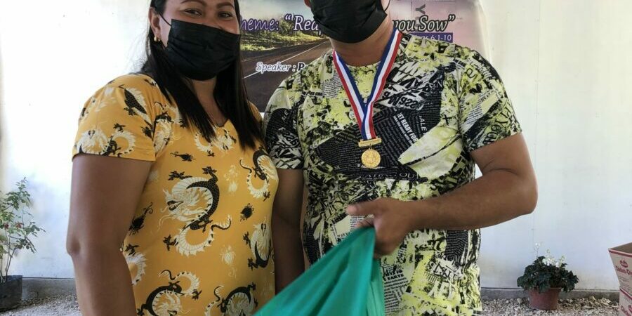 Regie-awarded-Top-1-during-the-Transform-Graduation_with-his-Wife-1-scaled-1