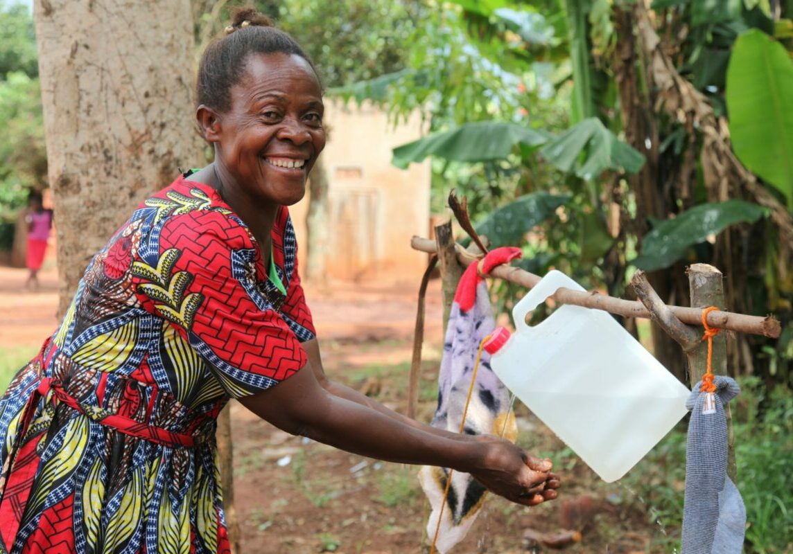 Robinah-washing-her-hands-using-her-tippy-tap-1-scaled-1