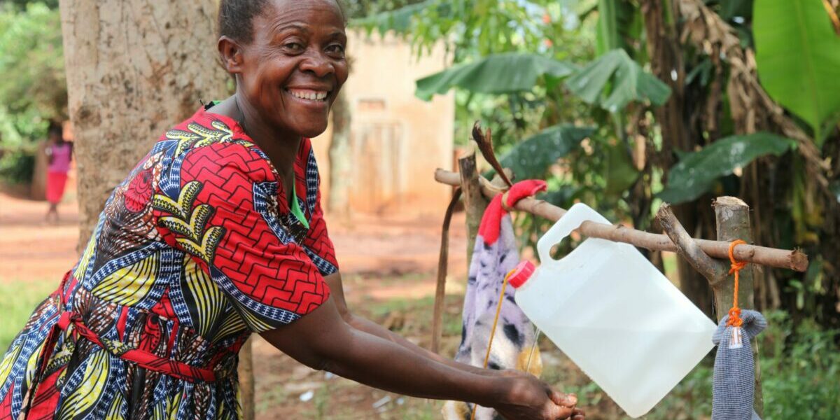 Robinah-washing-her-hands-using-her-tippy-tap-1-scaled-1