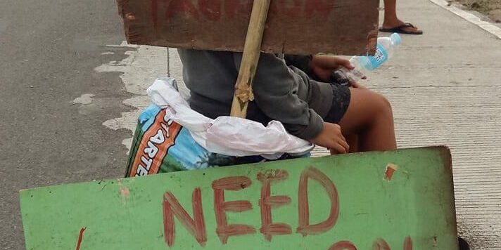 Signage-Need-Food-Help-Us-beside-the-Street-of-Bais-City-3