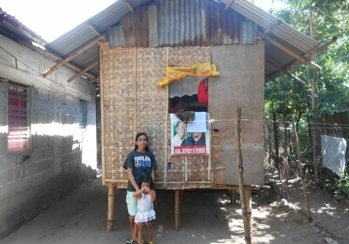 TF_Jojie-Sanchez_her-daughter-in-front-of-the-house-1-scaled-1