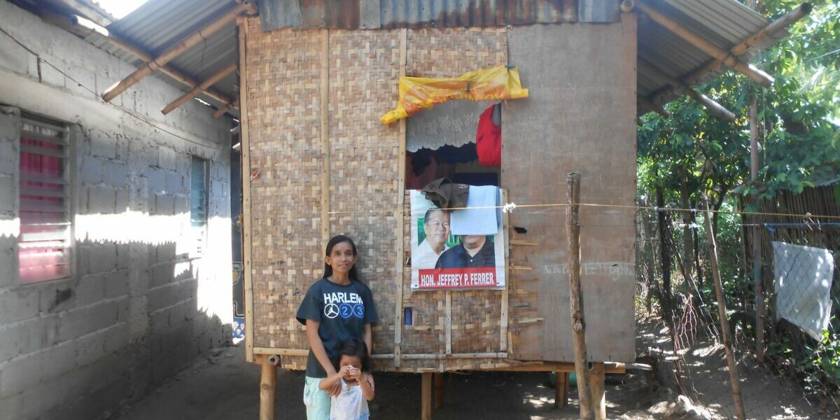 TF_Jojie-Sanchez_her-daughter-in-front-of-the-house-1-scaled-1